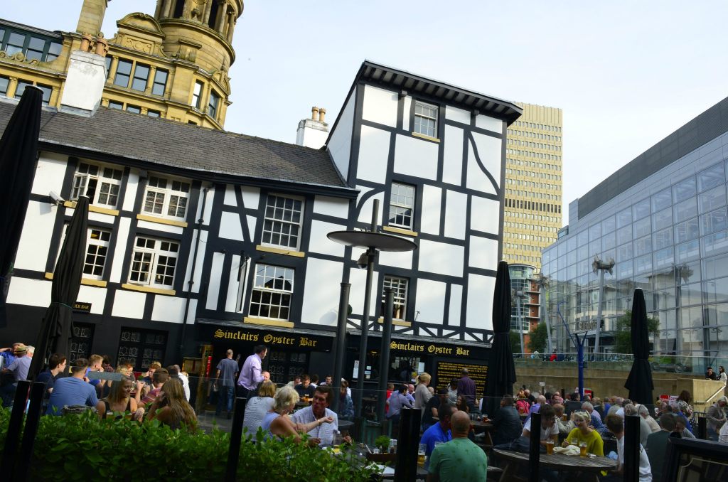 Sinclair's Oyster bar in Manchester outdoor seating area with guests enjoying social time